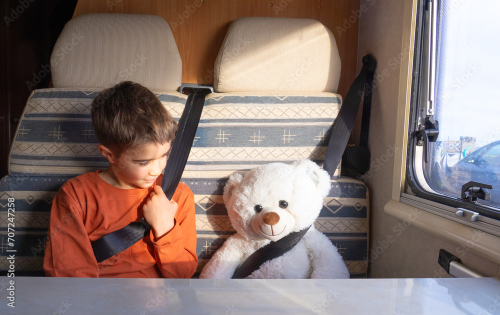 Boy and his teddy bear traveling together in a motorhome Stock Photo ...