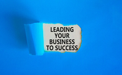 Wall Mural - Leading your business to success symbol. Concept words Leading your business to success on beautiful white paper. Beautiful blue paper background. Leading your business to success concept. Copy space