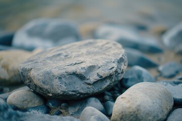 Wall Mural - A rock sitting on top of a pile of rocks. Suitable for nature and geology-related projects