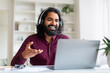 Web Conference. Smiling Indian Man In Headphones Making Video Call Via Laptop