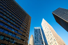 Low Angle View Of Modern Office Buildings In The Financial Area Of Poblenou In The City Of Barcelona In Catalonia In Spain