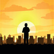 silhouette of a man looking at the city. Sunset