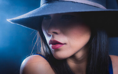 Portrait of young woman with elegant hat