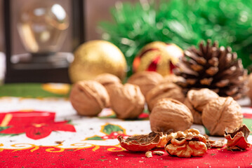 Christmas table, a beautiful table with nuts and christmas accessories, selective focus.