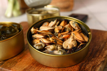 Wall Mural - Board with opened tin can of mussels, closeup