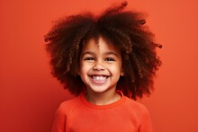 Portrait Of A Smiling African American Little Girl On A Red Background