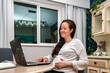 © Jessy - Pregnant Lady touching her belly shopping online for her baby shower registry