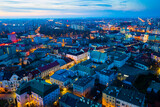Fototapeta  - Aerial view of illuminated streets and buildings at night, Rzeszow, Poland