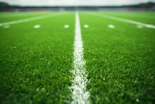 American Football Field, Green Grass With White Field Lines. Close-up Photo
