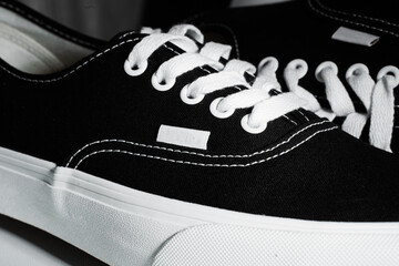 Black sneakers with a white sole