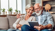 © 18042011 - A senior Caucasian couple cozily browsing a tablet on a couch, reflecting a comfortable, tech-savvy retirement life.