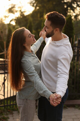 Poster - Lovely couple dancing together outdoors at sunset