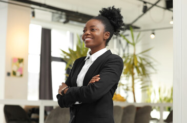 Sticker - Happy woman with crossed arms in office. Lawyer, businesswoman, accountant or manager