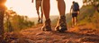 Hikers walking in fores in sunset light. Detail on hiker shoe rear view. copy space for text.