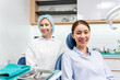 © Kawee - Portrait of Asian young woman patient and dentist at health care clinic.