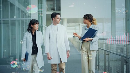 Poster - Multinational group in white coats talking while walking and statistical data concept.