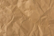 © zhikun sun - crumpled brown paper texture background.