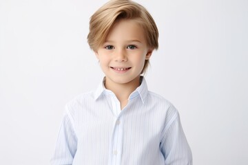 portrait of a little boy in a blue shirt on a white background