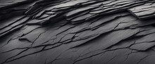 Black White Rock Texture Background. Rough Mountain Surface With Cracks. Close-up. Dark Gray Stone Basalt Background For Design. Banner. Wide. Long. Panoramic. Website Header.