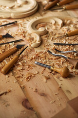 Poster - Wood carving tools. Carpenters hands use chisel. Senior wood carving professional during work. Man working with woodcarving instrument