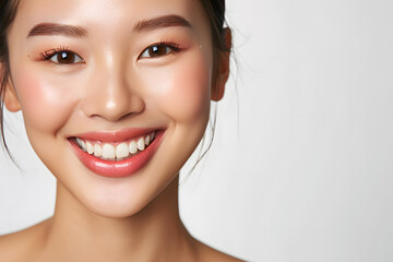 Young Asian woman close up portrait. Model woman laughing and smiling. Healthy face skin care beauty, skincare cosmetics, dental.