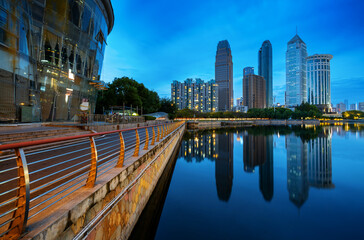 Wall Mural - Skyscrapers by the lake, night view of Wuhan, China.