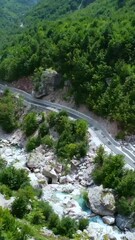 Wall Mural - Aerial shot over the waterfall river in Theth National Park, Albania