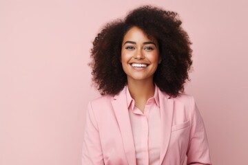 Canvas Print - Portrait of smiling african american businesswoman in pink suit