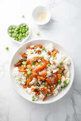 Wall Mural - Rice bowl with carrot and pea