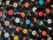 Top view of a pile of many vintage vinyl records background. High quality
