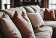 Close up of fabric sofa with white and terra cotta pillows French country home interior design of mo
