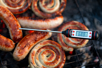 Digital thermometer shows safe cooking temperature