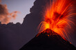 Volcano erupting at dusk, pyroclastics flowing