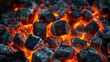 Glowing hot charcoal briquettes ready for grilling on a barbecue.