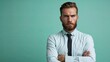 © MiguelAngel - Portrait of a businessman with serious and defiant look, isolated on green background.