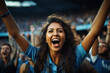 indian women cricket fan wearing blue jersey cheering
