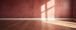 Light maroon wall and wooden parquet floor, sunrays and shadows from window 
