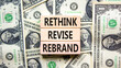 Rethink revise rebrand symbol. Concept word Rethink Revise Rebrand on block. Dollar bills. Beautiful dollar bills background. Business brand motivational rethink revise rebrand concept. Copy space.