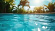 The sun shines brightly on the water in the pool. Perfect for summer-themed designs and advertisements