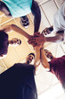 © Marko Geber - Young men in team huddle at basketball indoor gym