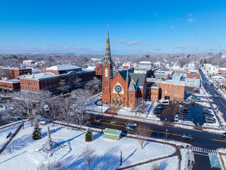 First Congregational Church aerial view in winter with snow at 2 E Central Street in historic town center of Natick, Massachusetts, USA.