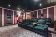© alhim - A home theater for private viewing, decorated in pink and lilac tones with luxurious gray armchairs.