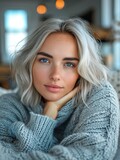 Fototapeta Panele - Beautiful hot girl in a knitted sweater with a deep neckline, portrait in warm colors in the style of a home photo