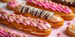 Assorted eclairs on a pastel background with copy space. Sweet eclair with cream icing and filling.