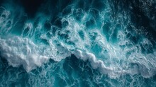 Beautiful Photo Of Blue Water Flowing In Waves With White Foam In A Ocean. Taken From Up Top Above Perspective. Wallpaper Background 16:9
