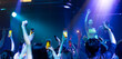 © NVB Stocker - music concert live on stage. Audience Captures the show with smartphone. diverse young people dancing in night club. Nightlife and disco dance party concept. Fun music festival