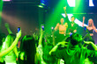 © NVB Stocker - Audience Captures the show with smartphone. music concert live on stage. diverse young people dancing in night club. Nightlife and disco dance party concept. Fun music festival
