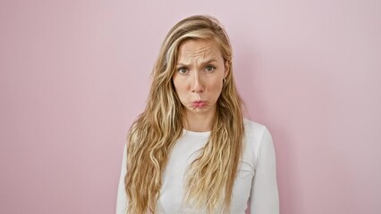 Sticker - Worried and upset young blonde woman standing over pink background. sad, depressed expression with tears of stress and anger. feeling the pain of worry in isolation.