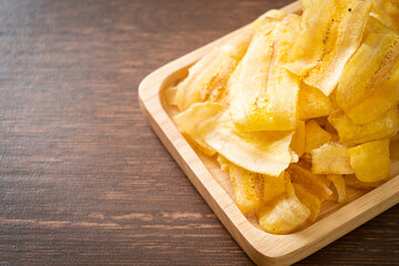 Wall Mural - Banana Chips - fried or baked sliced banana