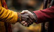 © Bartek - Close-up of a heartfelt handshake between two people, showcasing a multicultural bond of respect and friendship